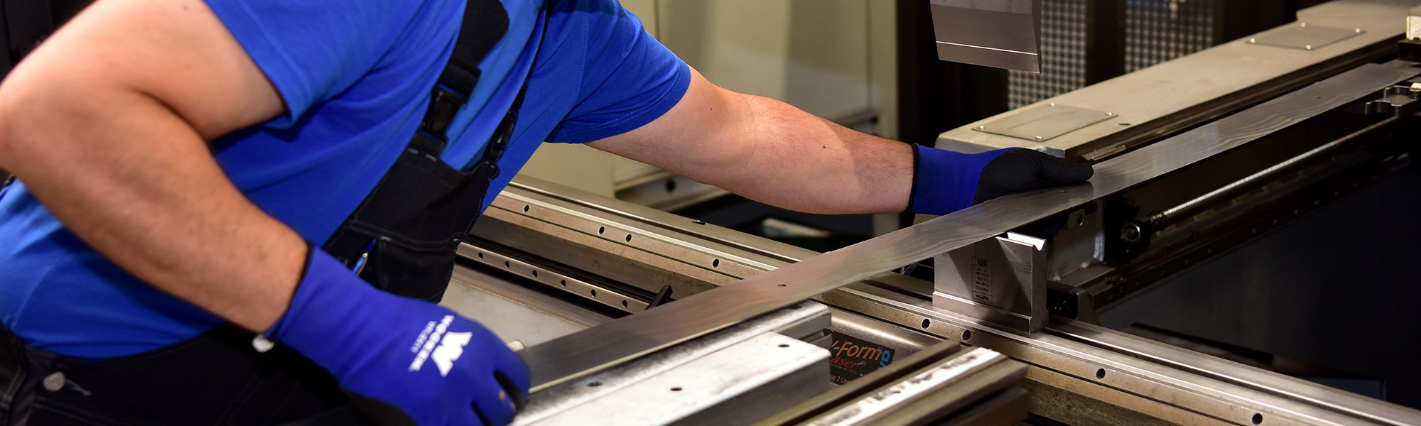 Employee shapes material by hand